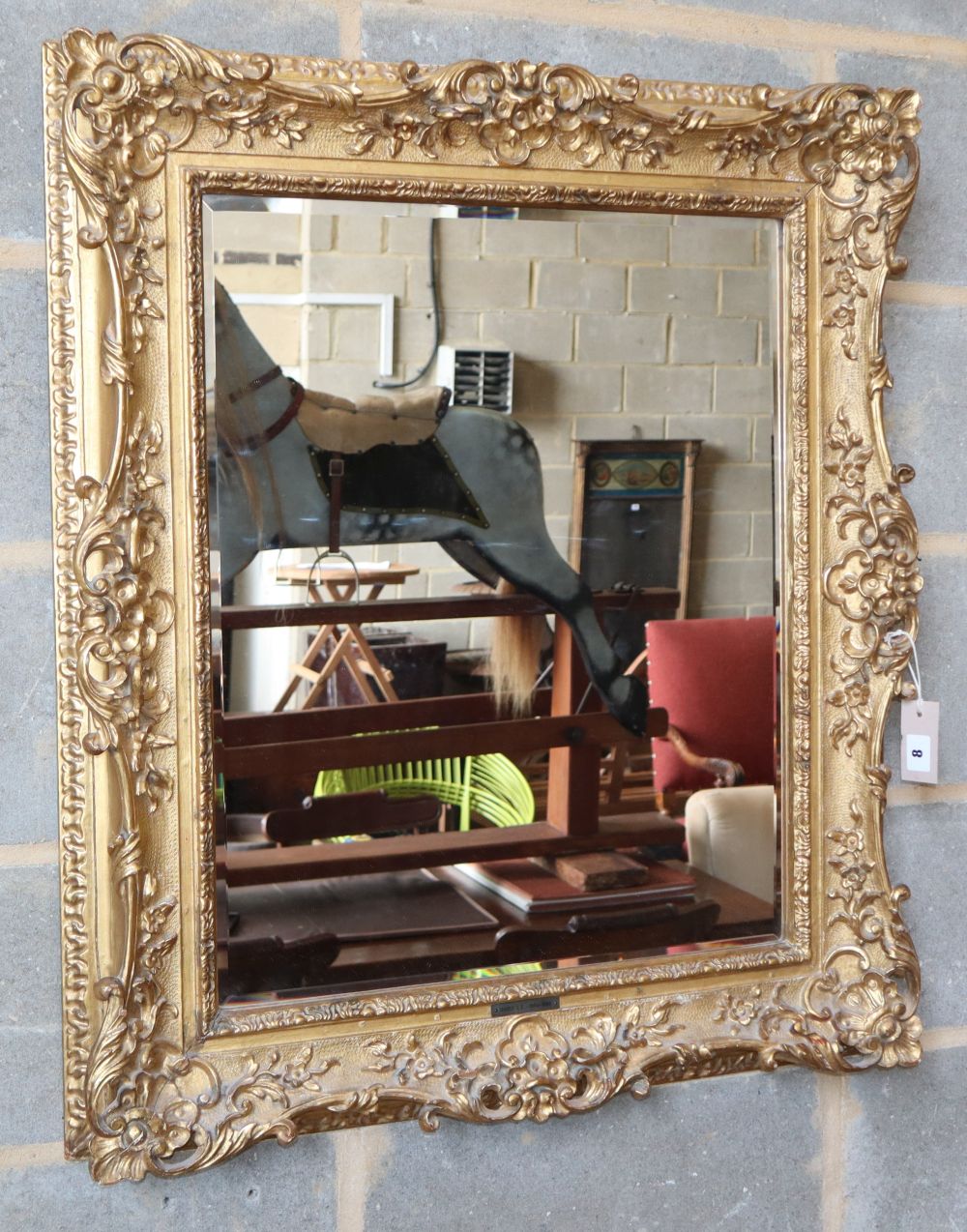 A giltwood and gesso wall mirror, W.74cm, H.86cm, aperture 51 x 62cm